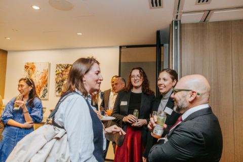 Cuttleflow launch, 10 September 2026, Level 29, 25 Martin Place, Sydney — Guests by the artworks (photograph 13 of 15)